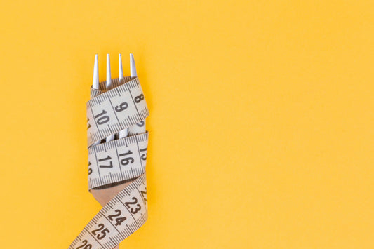 Fork with measuring tape wrapped around it