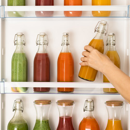 Juice bottles on refrigerator door