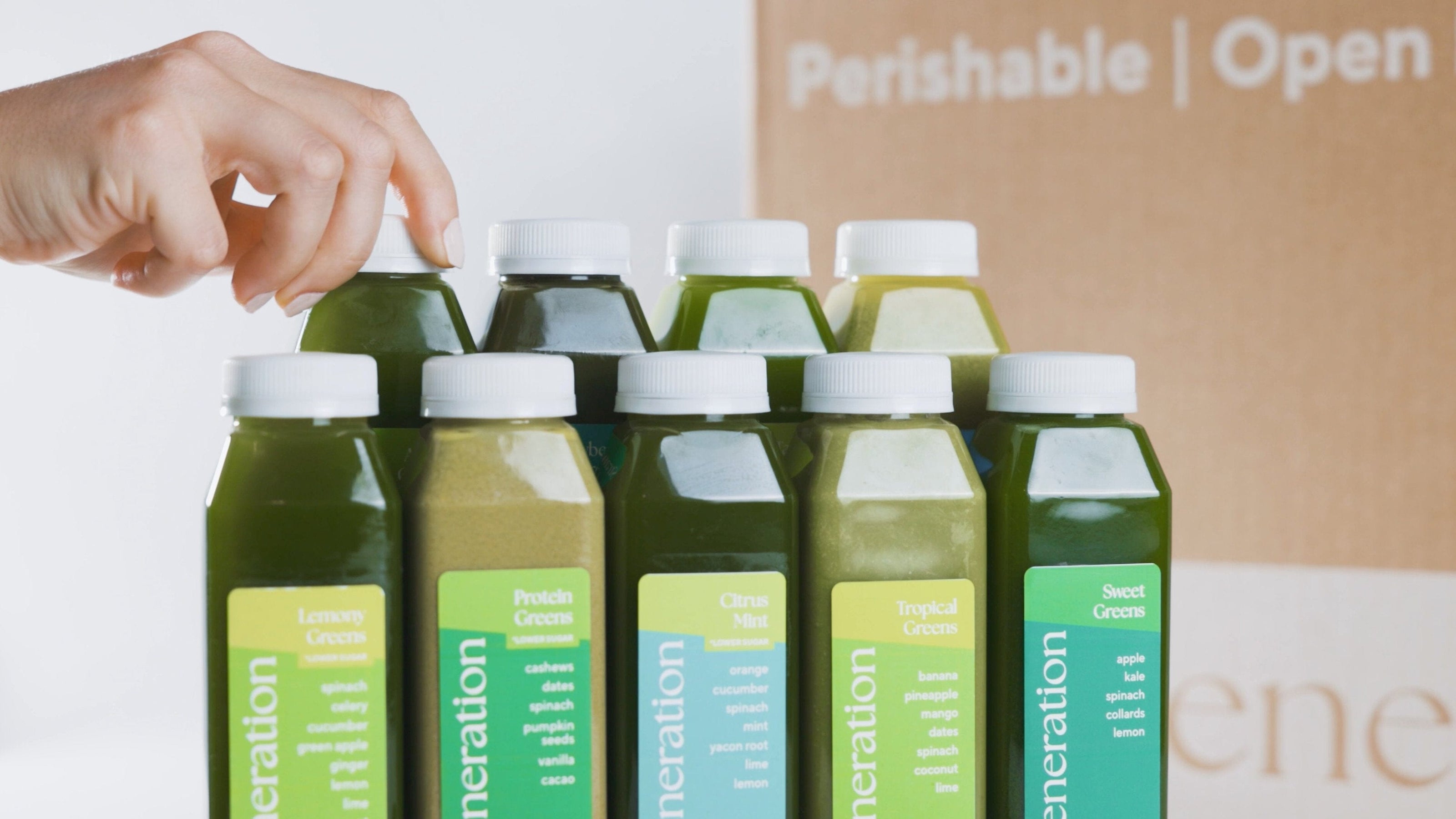 Womans hand grabbing from Raw Generation low sugar detox cleanse