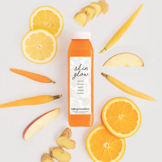 Bridal Skin Glow juice bottle with carrot, orange, apple, ginger, and lemon slices, promoting immunity with 110% daily Vitamin C.