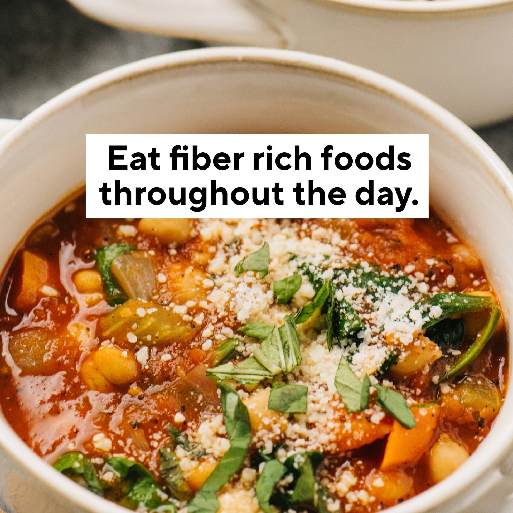 Deep Detox Cleanse: A bowl of vegetable soup with chickpeas, carrots, and greens, topped with cheese and parsley, promoting fiber-rich, chlorophyll-packed detox benefits.