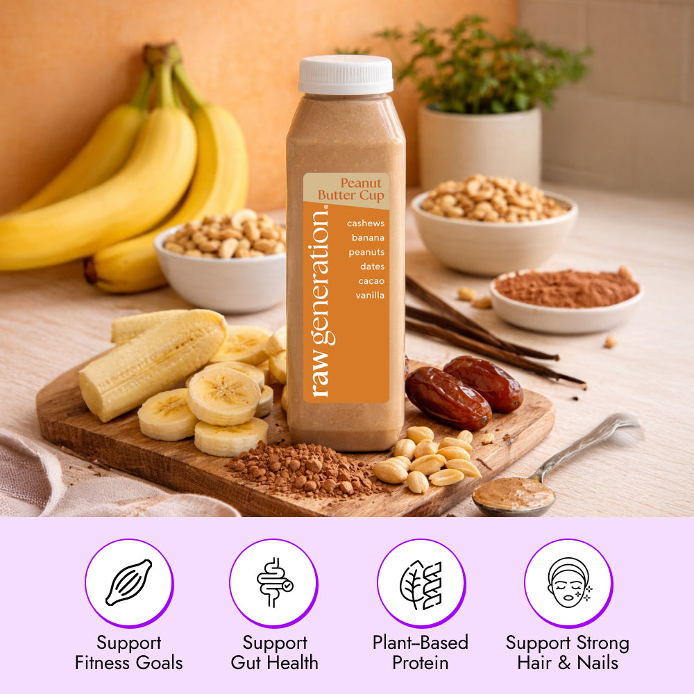 Peanut Butter Cup Smoothie bottle with cashews, banana, peanuts, dates, cacao, and vanilla on a board, emphasizing plant-based protein and fitness benefits.