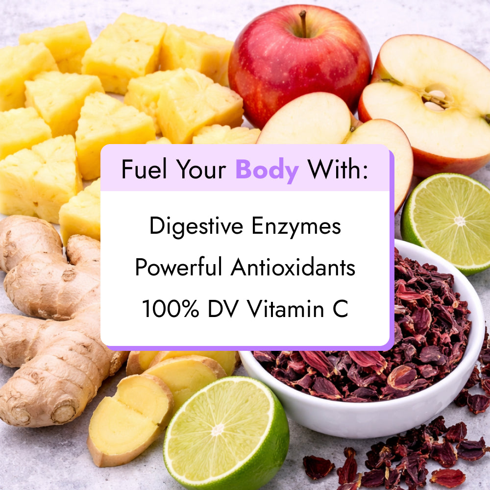 Skinny Boost™ Enhancer Shot (2-Count) surrounded by pineapple, apple, lime, ginger, and hibiscus, highlighting natural digestive enzymes, antioxidants, and Vitamin C content.