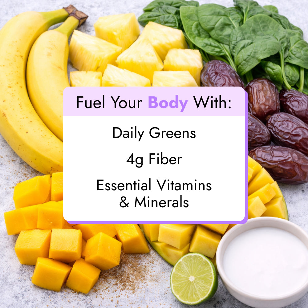 Tropical Greens Smoothie ingredients displayed: bananas, pineapple chunks, mango cubes, spinach, Medjool dates, halved lime, and coconut milk, promoting fiber and essential vitamins.
