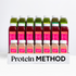 Protein Method™ display with green juices, Strong & Lean red juices, and Protein Boost shakes in a branded tray, designed for fitness and weight loss.