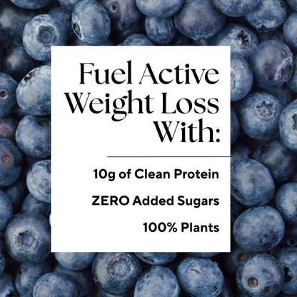Protein Boost™ (2 Count) bottles surrounded by fresh blueberries, highlighting its blueberry juice ingredient and PB&J flavor for nutritious workout support.