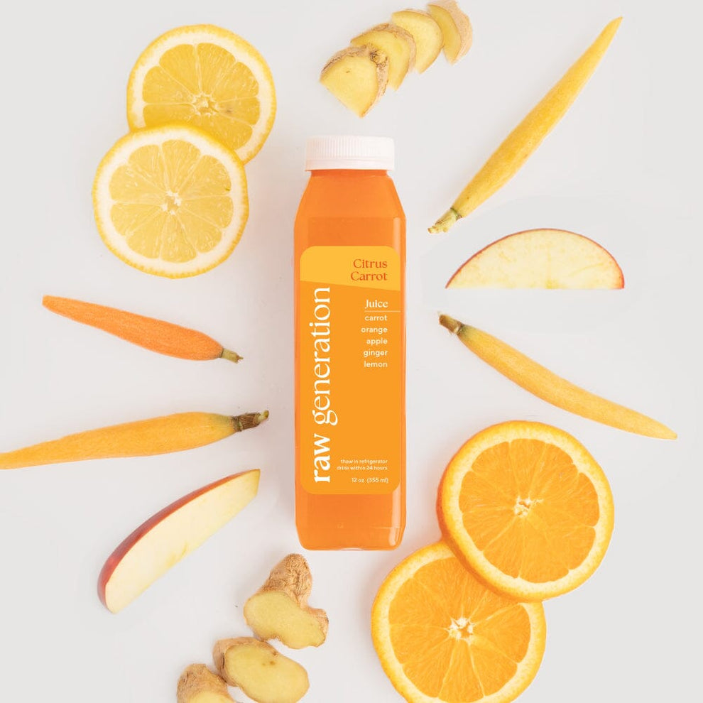 Citrus Carrot juice bottle surrounded by sliced oranges, carrots, apple, and lemon, highlighting its Vitamin C-rich, immunity-boosting ingredients.