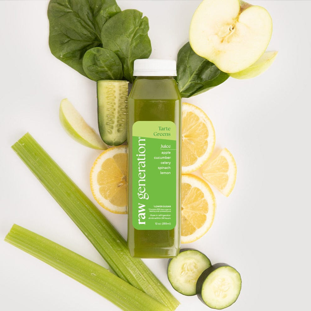 Tarte Greens bottle surrounded by apples, cucumbers, and lemons, highlighting its nutritious blend with 7g protein, Vitamin C, and Vitamin A.