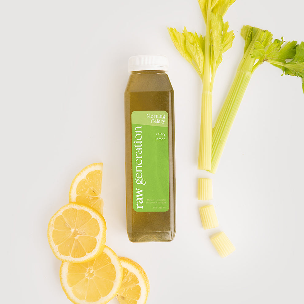 Morning Celery Juice bottle next to fresh lemons and celery, highlighting its refreshing ingredients for a revitalizing daily health routine.