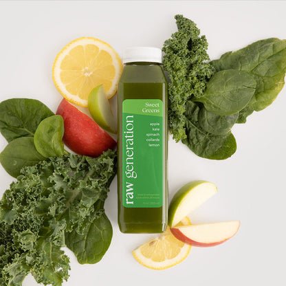 Sweet Greens Juice bottle surrounded by apples, lemon slices, and leafy greens, highlighting its nutrient-rich ingredients like kale, spinach, and collards.